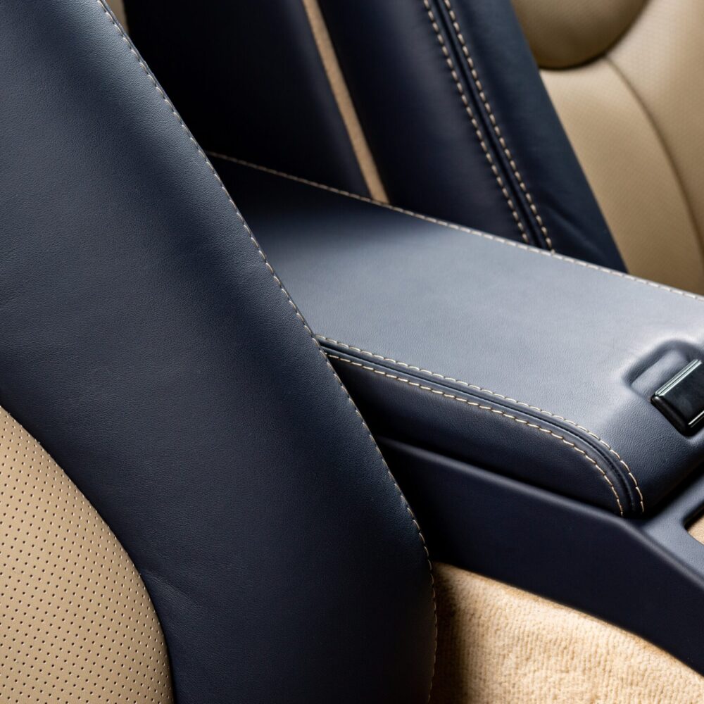 The glove compartment of a car with black leather